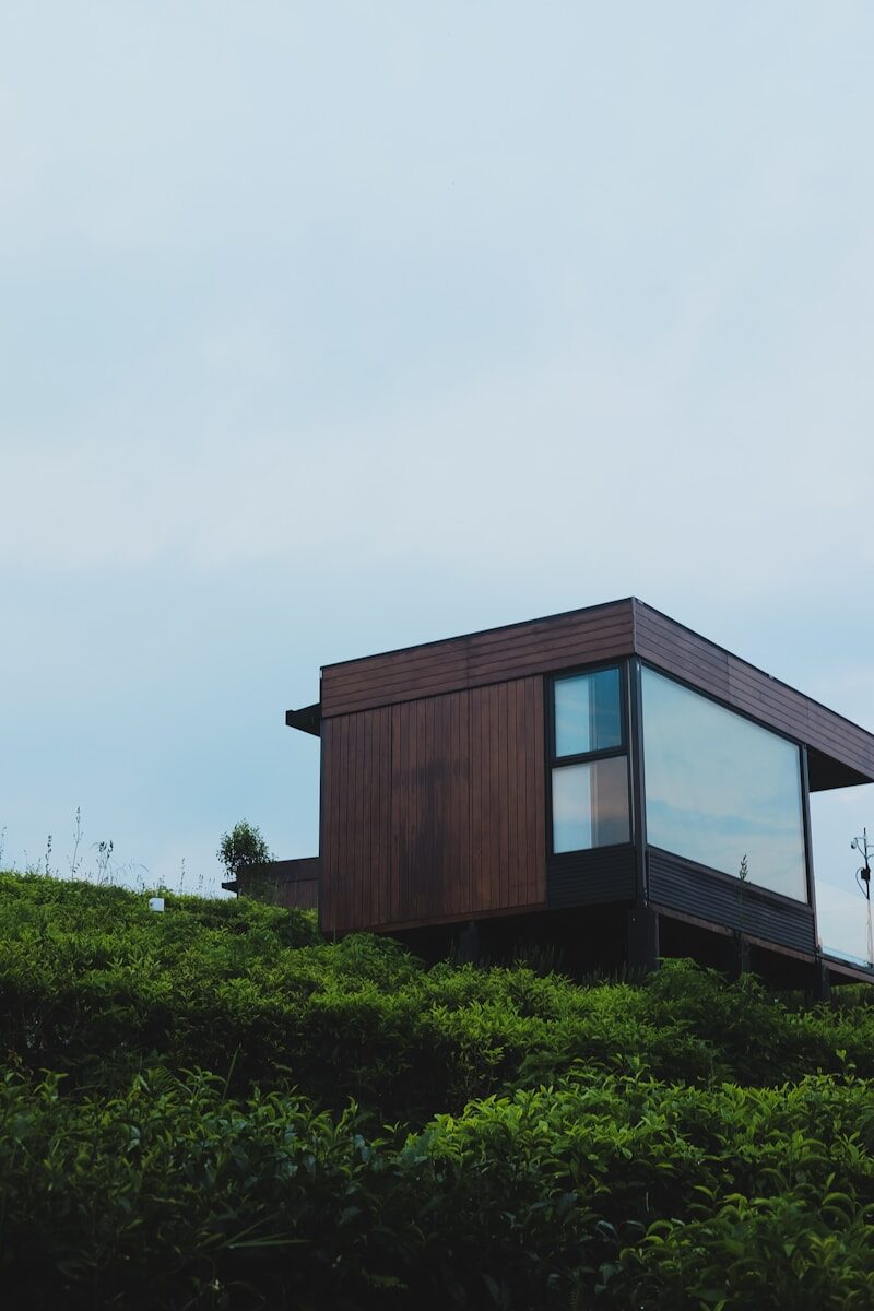 Modern cabin nestled on a green hillside